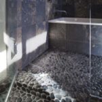 Black pebble pool - pebble tiles instalation