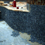 Black pebble pool - pebble tiles instalation