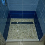 Stone pebble bathtub - pebble tile bathroom ideas